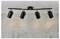 'Ceiling light fixture with four adjustable black spotlights, mounted on a black bar with decorative gold rings, against a concrete wall.'