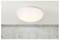 Ceiling light fixture mounted on a white ceiling, above a concrete wall. The fixture emits a soft, white glow, indicating it's turned on.
