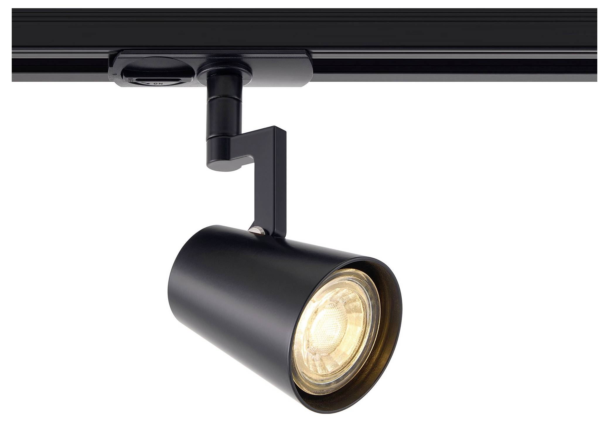 A black track lighting fixture with a cylindrical spotlight is mounted on a track. The light is turned on, illuminating the bulb.