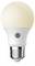 A white LED light bulb with a silver base and a round, frosted glass top illuminated with a warm glow.