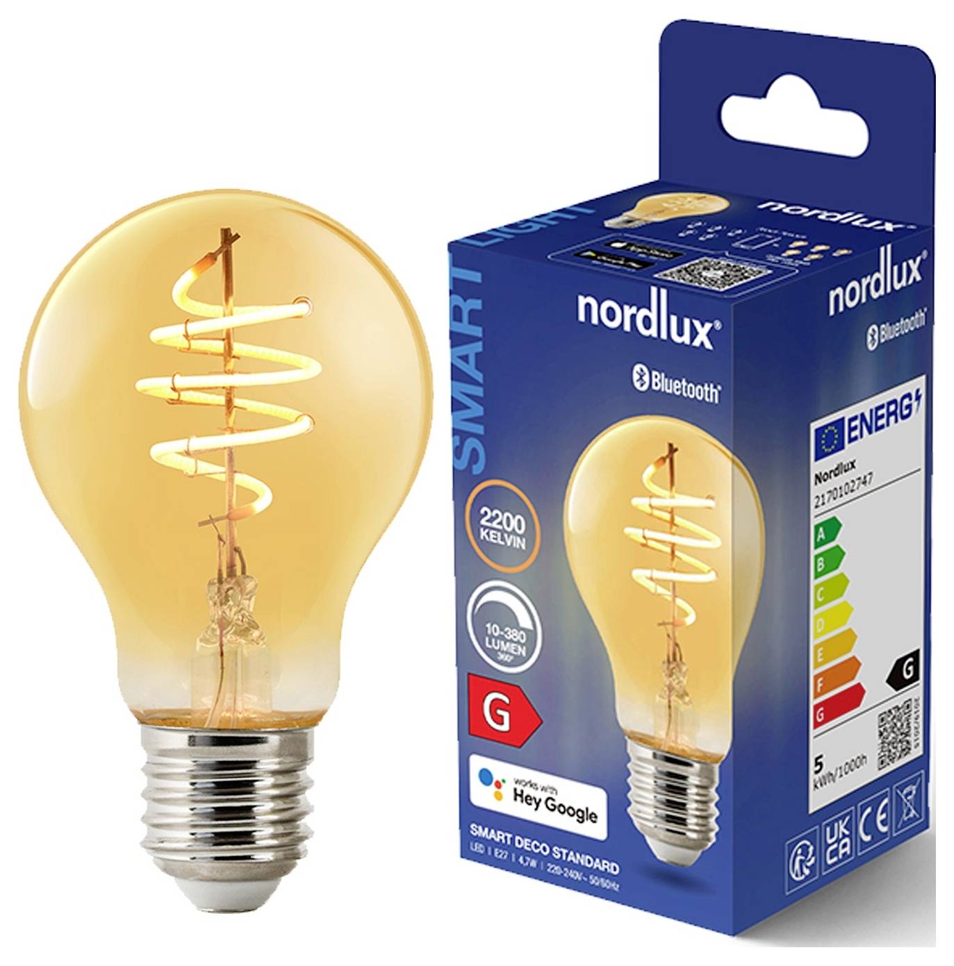 A glowing LED light bulb with a spiral filament is next to its retail box. The box highlights features like Bluetooth connectivity and energy efficiency.