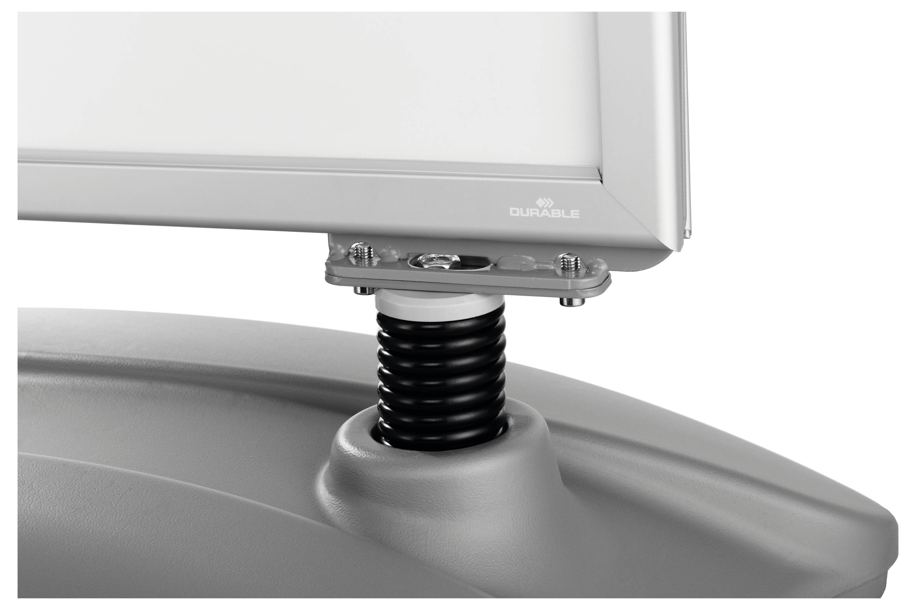 A close-up of a monitor stand with a spring mechanism attached to a base, designed for durability and ergonomic support.