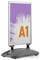 A poster stand displaying the text 'A1' in large orange font on a purple background with a white abstract design.