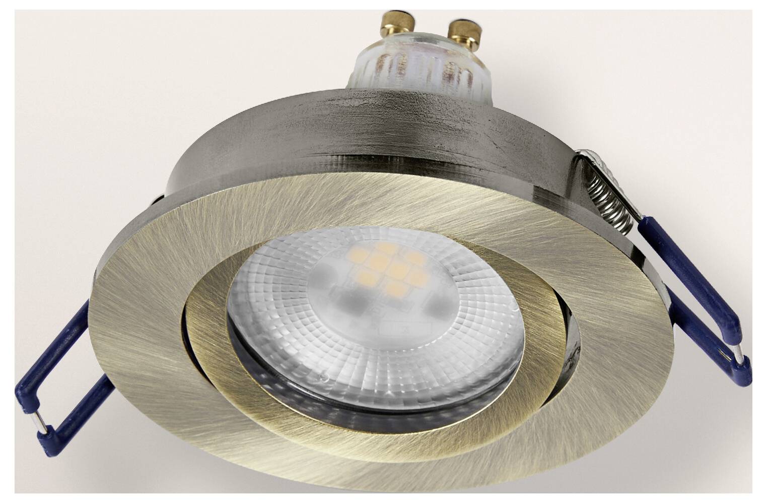 A round, recessed ceiling light fixture with a brushed metallic finish, featuring an LED bulb, shown against a white background.