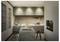 A modern kitchen with marble-topped island, high stools, built-in oven, and coffee maker. Warm lighting and sleek cabinets create a cozy atmosphere.