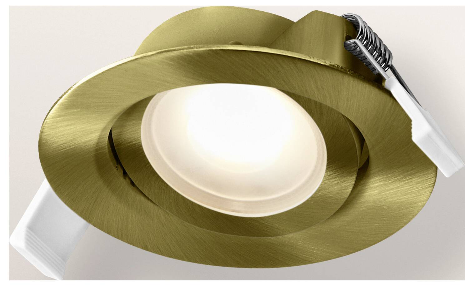 A recessed ceiling light with a brass finish and a white bulb, designed for modern interiors.