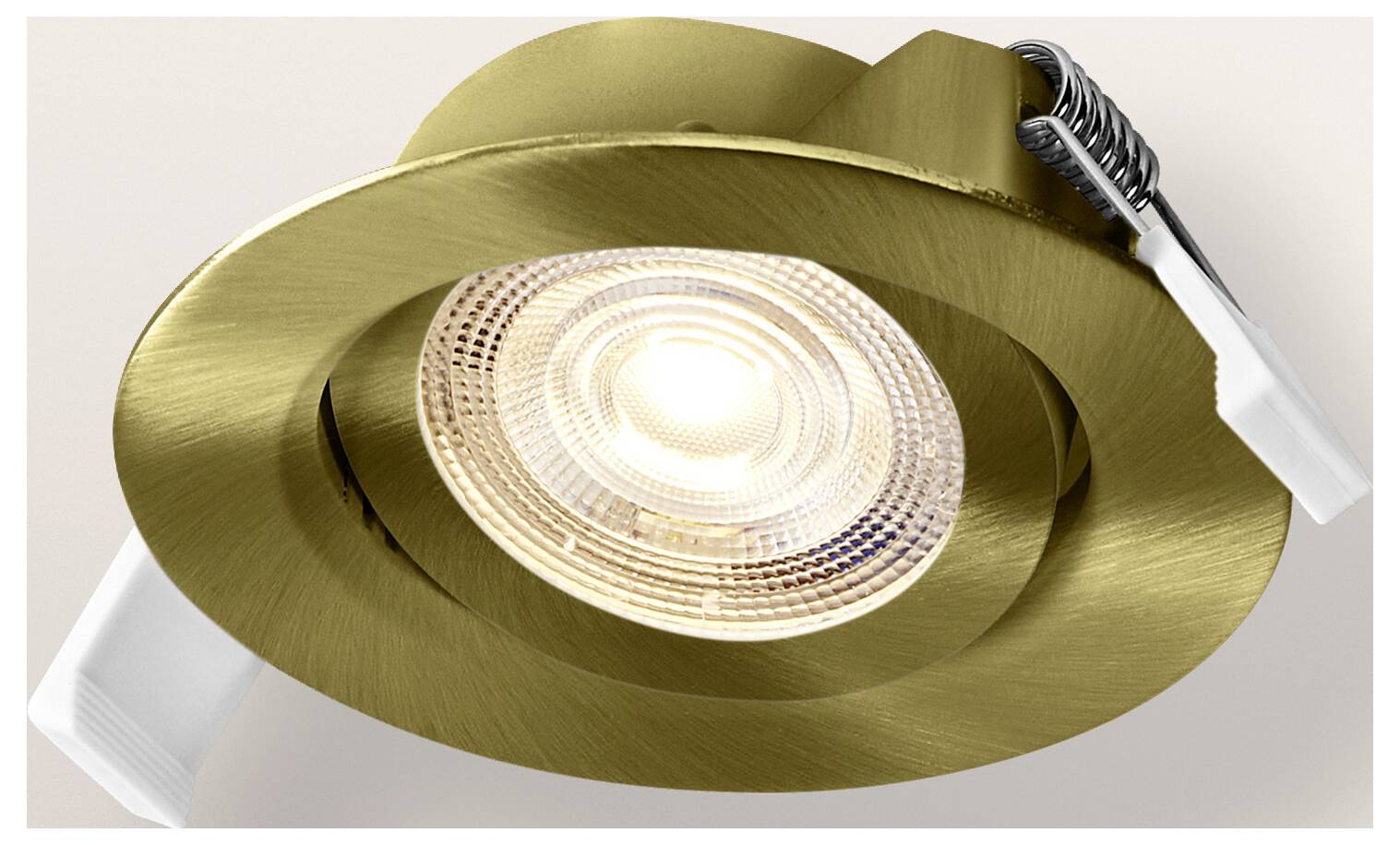 A gold-colored recessed ceiling spotlight with a ridged glass bulb design, mounted with spring clips on a neutral background.
