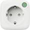 A white electrical outlet with two round holes and a small green logo at the top right corner.