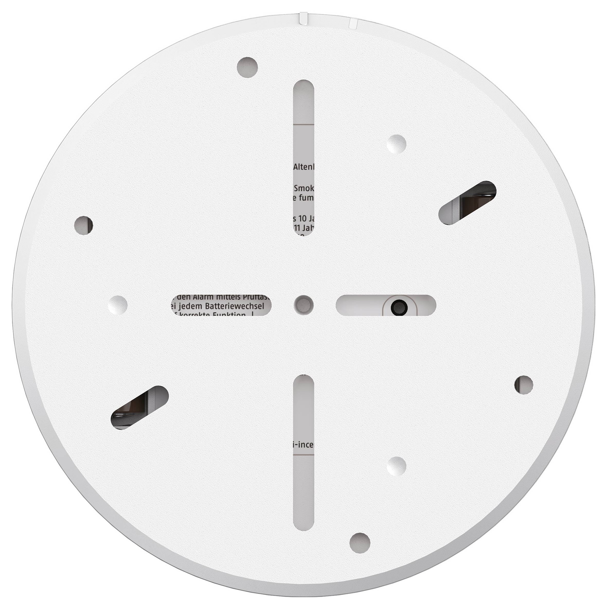'Back view of a round, white smoke detector base with mounting slots and visible battery compartment.'