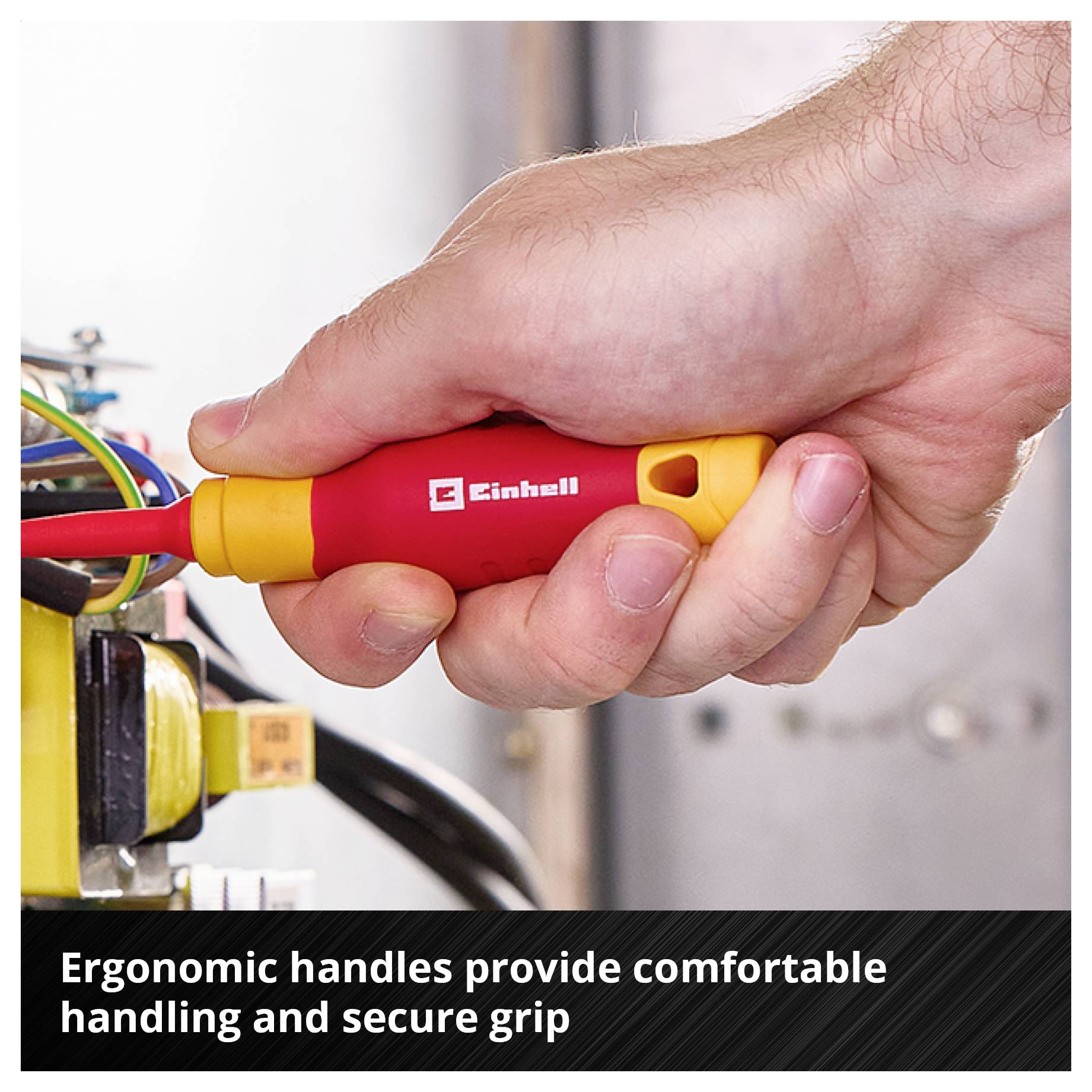 Hand holding a red and yellow Einhell screwdriver at the cable connection; below it states: 'Ergonomic handles offer comfortable handling and secure grip'