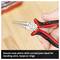 Close-up of a round-nose pliers with round jaws, being held by a hand; suitable for bending wire, rings or loops.