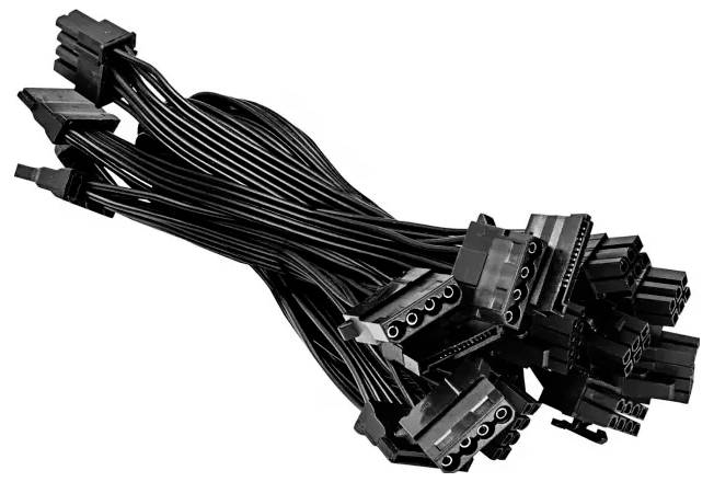 A bundle of black computer power supply cables with multiple connectors, arranged in a messy pile.