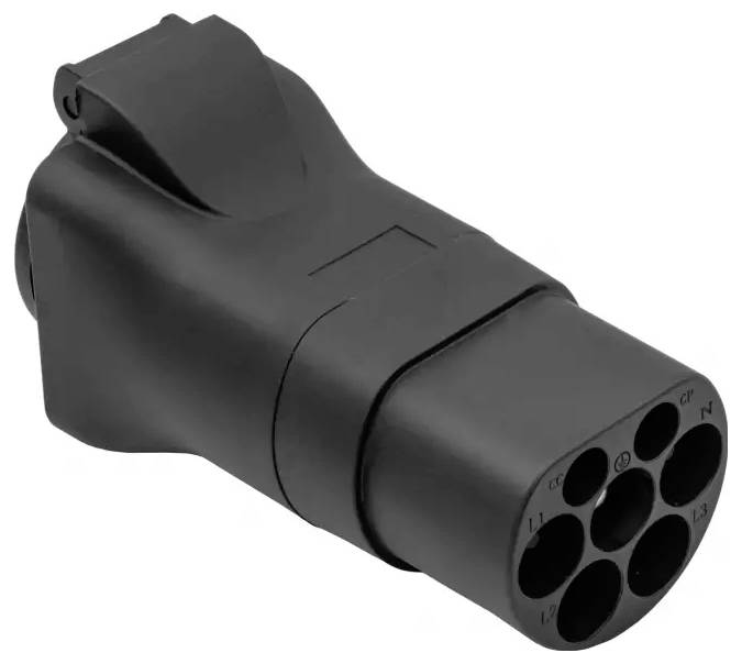 A black electric vehicle charging plug features a rectangular shape with seven circular connectors for power and communication.