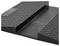 A black rubber threshold ramp with a textured surface designed for wheelchair accessibility.