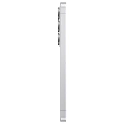 A silver smartphone viewed from the side, showing its slim profile with three rear camera lenses.