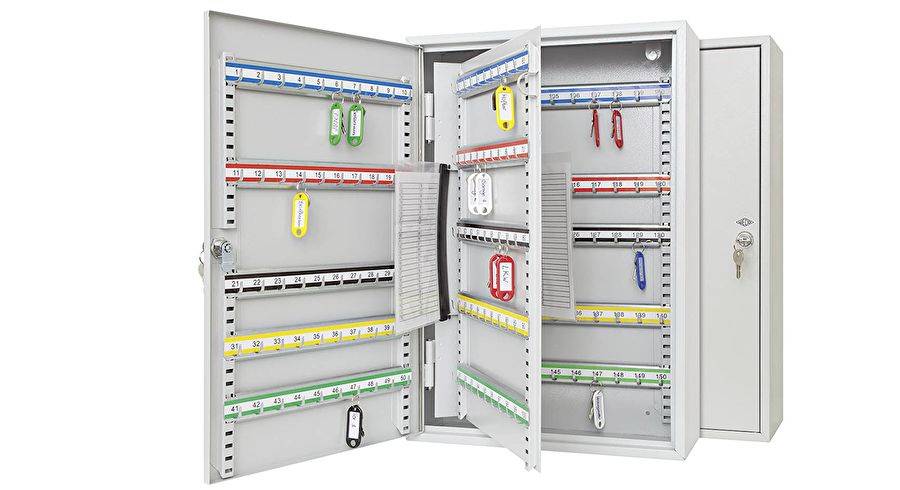 Key cabinet open with assorted colored keys organized on labeled hooks, showcasing efficient key management storage with a locking mechanism.