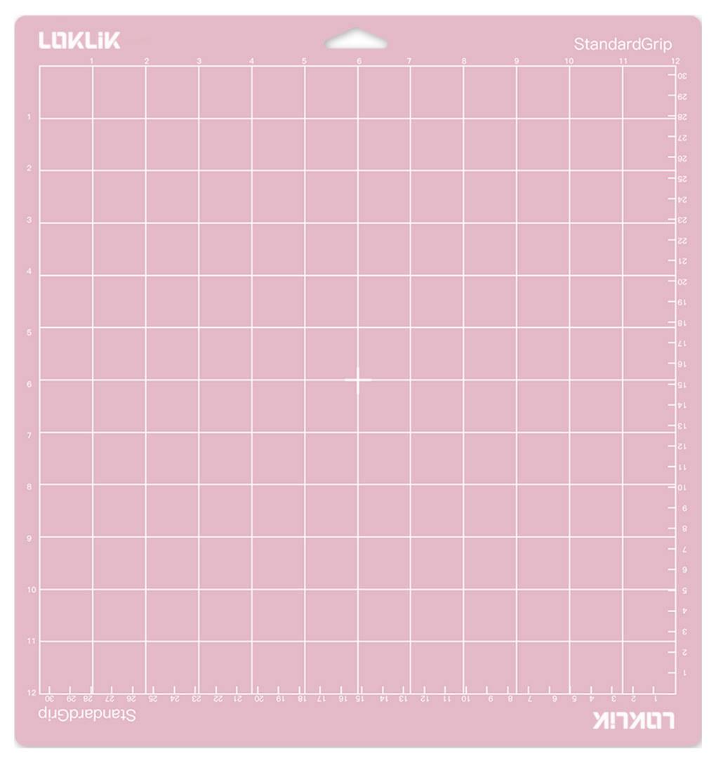 'A pink cutting mat with a grid and measurements along the edges, labeled 'LOKLIK StandardGrip'. Ideal for precise cutting tasks.'