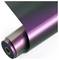 A roll of glossy, color-shifting vinyl wrap, with iridescent hues ranging from deep green to bright purple, partially unrolled.