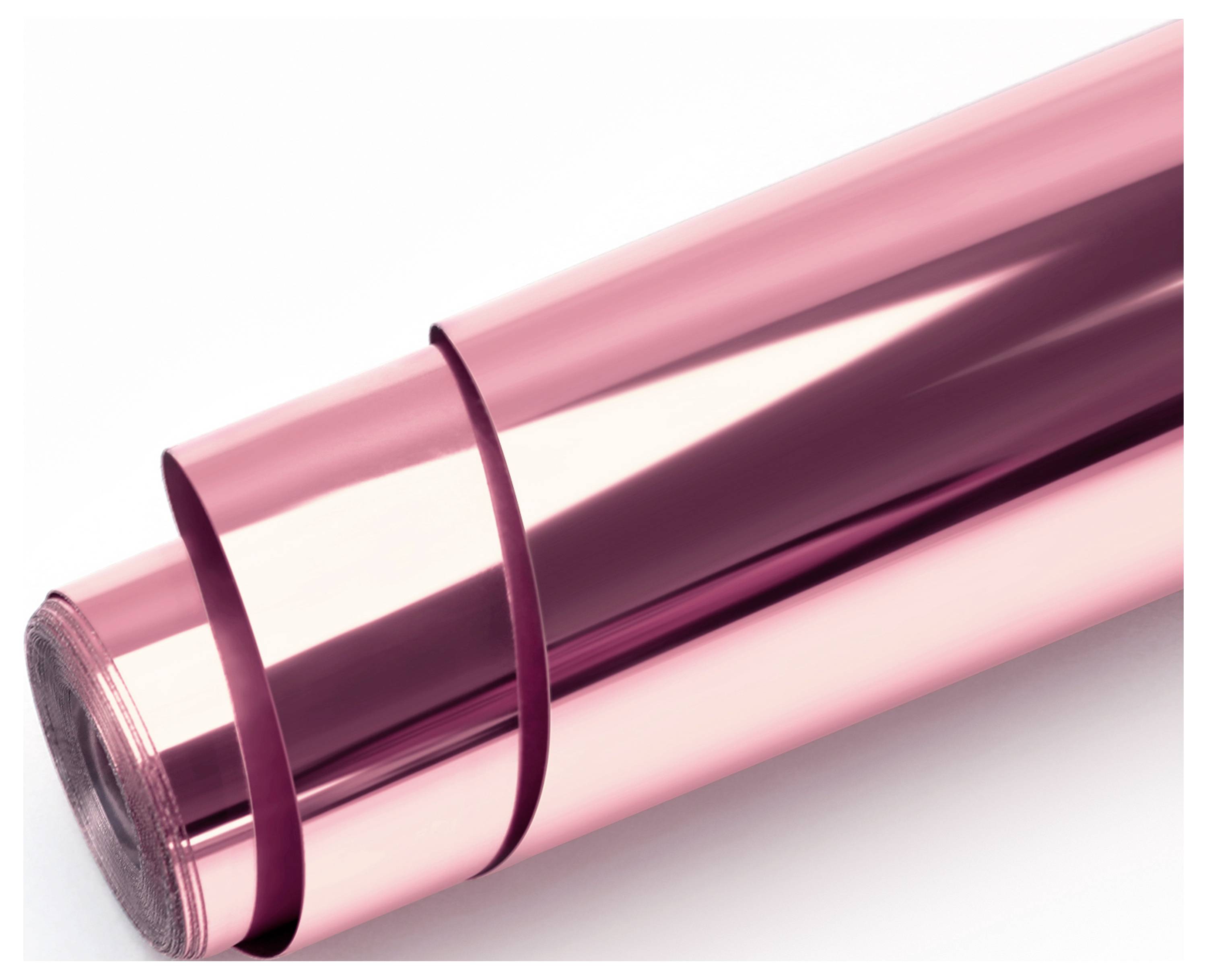 A roll of shiny, metallic pink wrapping paper partially unrolled, reflecting light.