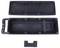 'Plastic casing of a portable device, open to show internal compartments and handle. Includes a central divider piece beneath the main case.'
