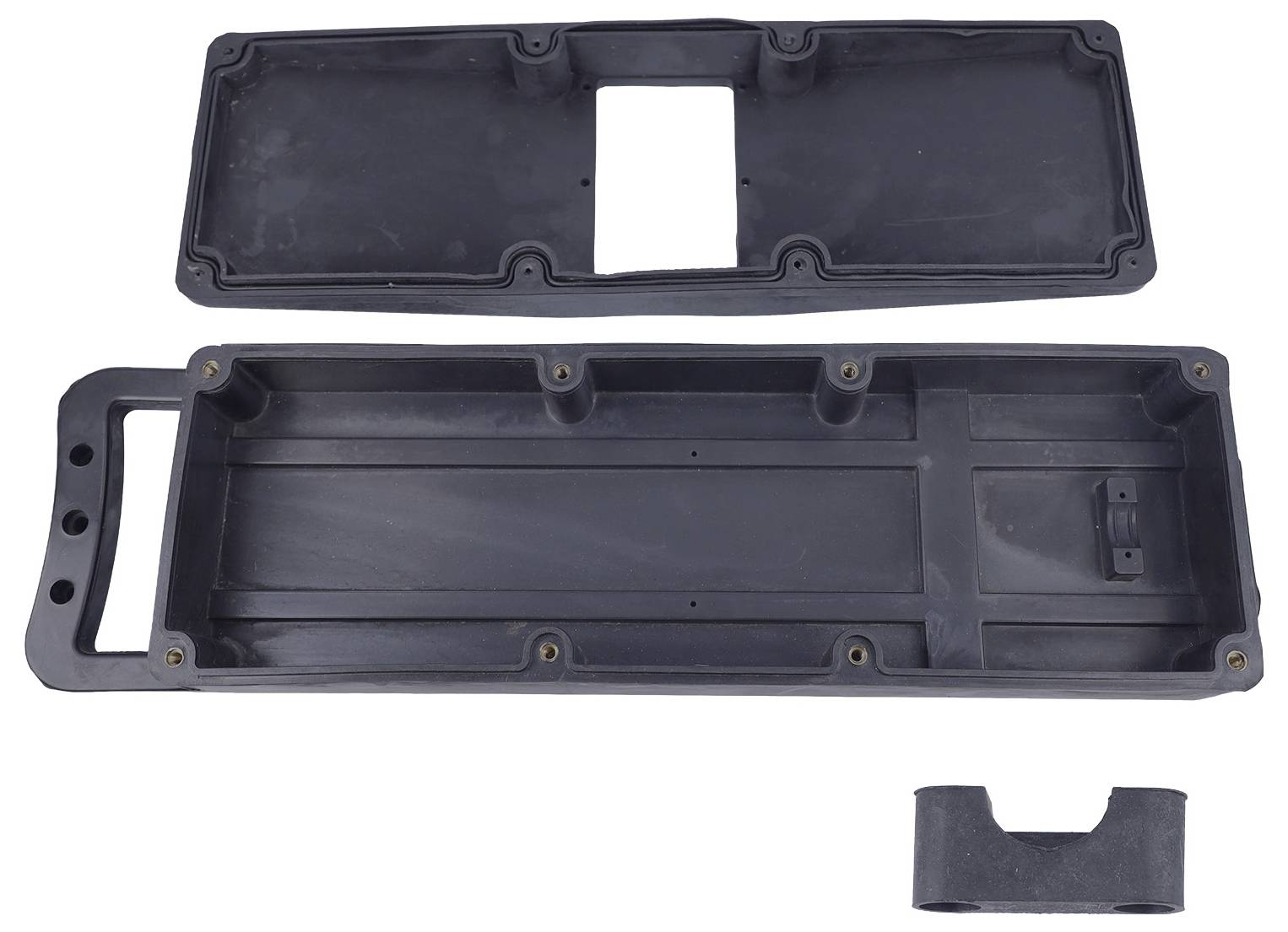 A black plastic enclosure with a rectangular cutout, handle, and multiple mounting points, shown in three separate pieces.