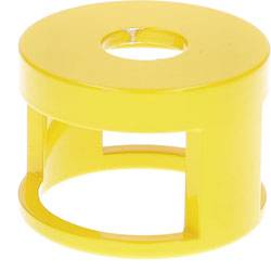 A small, round, yellow plastic object with a circular hole in the center, resembling a spool or bobbin.