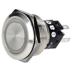 'Metal push button switch with a round flat surface and threaded body, featuring three prongs for electrical connection at the back.'