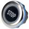 A round metallic button with the word 'STOP' on a dark background, indicating an action to cease or halt an operation.