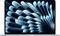 A laptop displaying a dynamic blue and black abstract pattern with curved lines on its screen, suggesting modern technology.