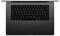 A laptop viewed from above, showing a black keyboard and large trackpad, designed for productivity and creative tasks.