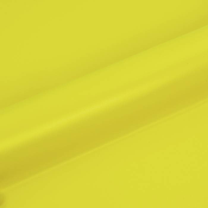 A bright yellow surface with a subtle diagonal crease or texture running across the image.