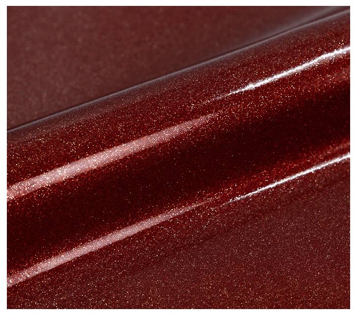 A close-up view of a shiny, metallic red surface with a smooth texture and light reflection, highlighting its glossy finish.