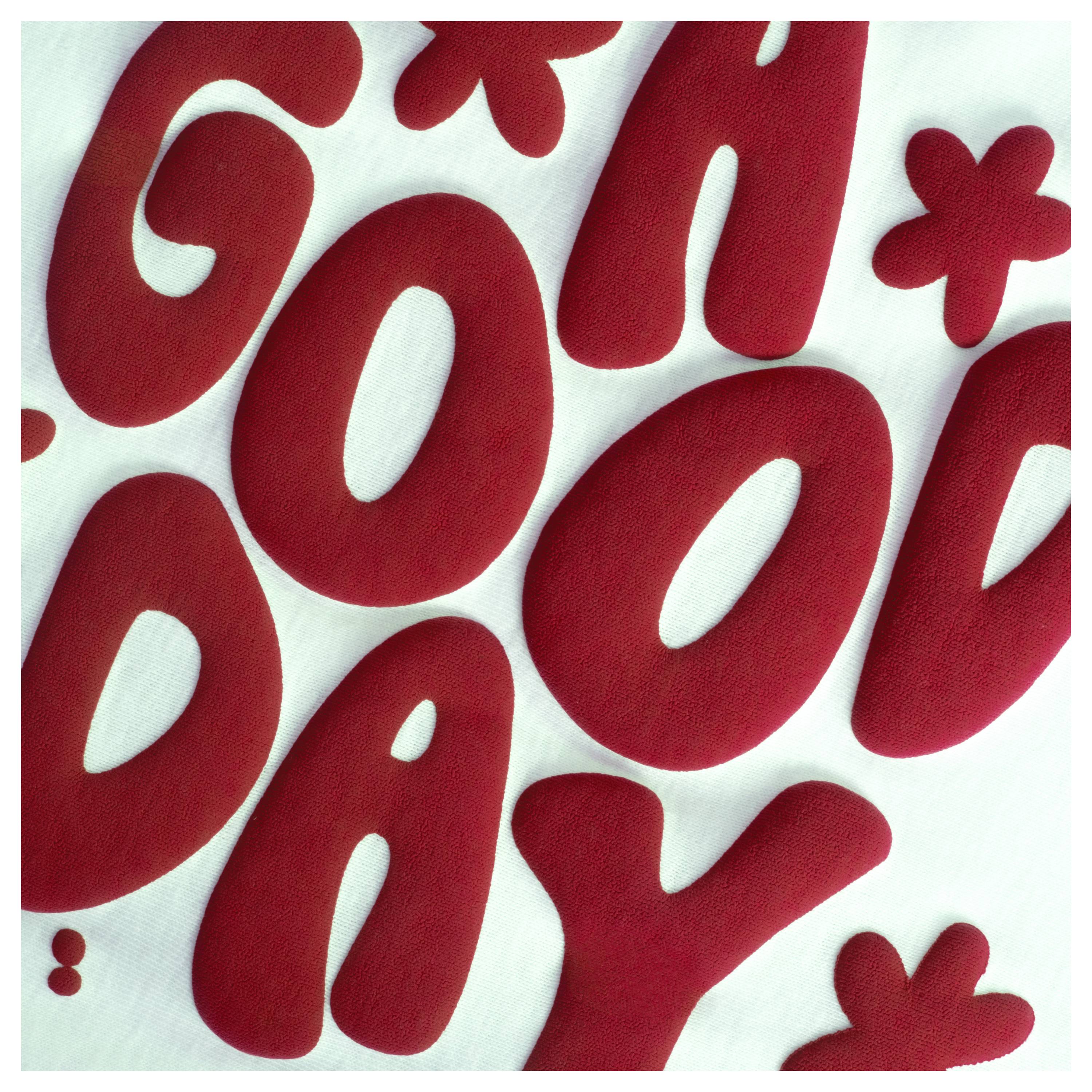 The image features bold, red letters spelling out 'GOOD DAY' on a white background.