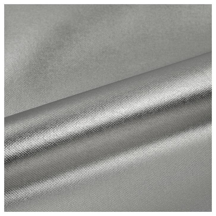 A close-up of smooth, metallic silver fabric with a reflective sheen and slightly textured surface, draped in soft folds.