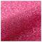 A close-up of pink glitter with a shimmering, textured surface, creating a sparkling, reflective effect.