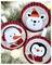 Three festive round ornaments with cartoon faces: a polar bear wearing a hat, a snowman with earmuffs, and a penguin.