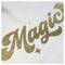 The image shows the word 'Magic' written in glittery gold script on a white fabric background.