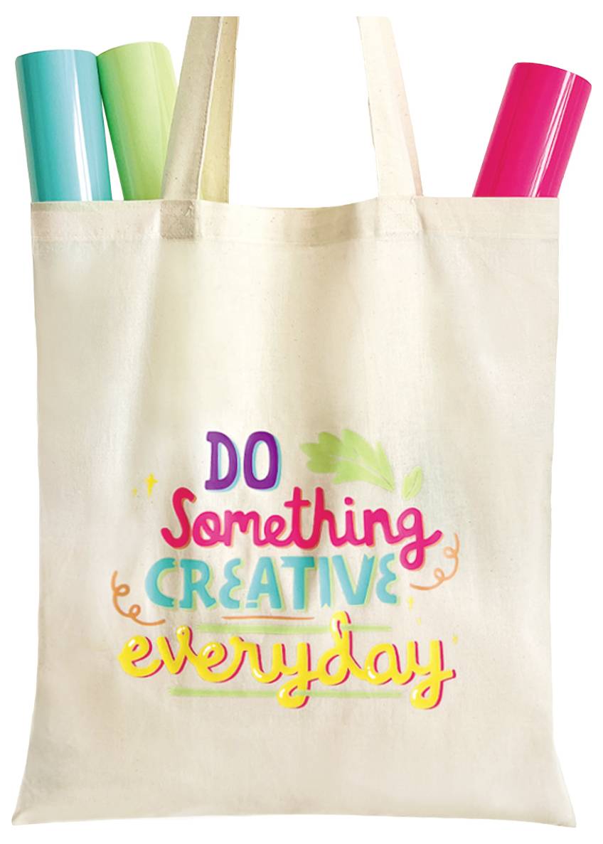 A canvas tote bag with the text 'Do Something Creative Everyday' in colorful letters and bright rolls of vinyl peeking from the top.