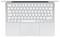 A silver laptop keyboard, viewed from above, displaying QWERTZ layout with a large touchpad below.