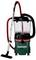 Industrial vacuum cleaner with a transparent dust container, red and black hose, green base, and the brand name 'Metabo' on the front.