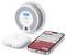 A home safety system featuring a smoke detector, a gateway device, and a smartphone app displaying a 'CO Alarm Triggered' alert.
