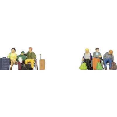 Miniature figures of travelers sitting on benches with luggage, depicting two groups of people dressed in casual attire.