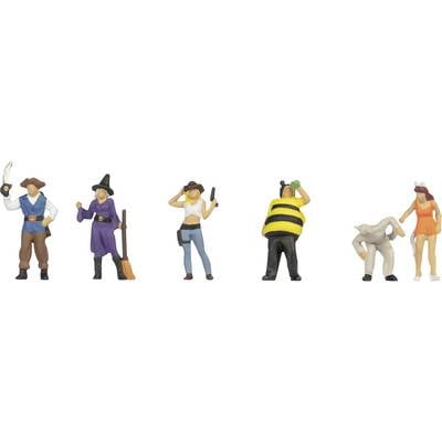 'Miniature figures in costume: pirate, witch, cowgirl, bee, creature, fairy. Each poses uniquely, evoking a playful, festive theme.'
