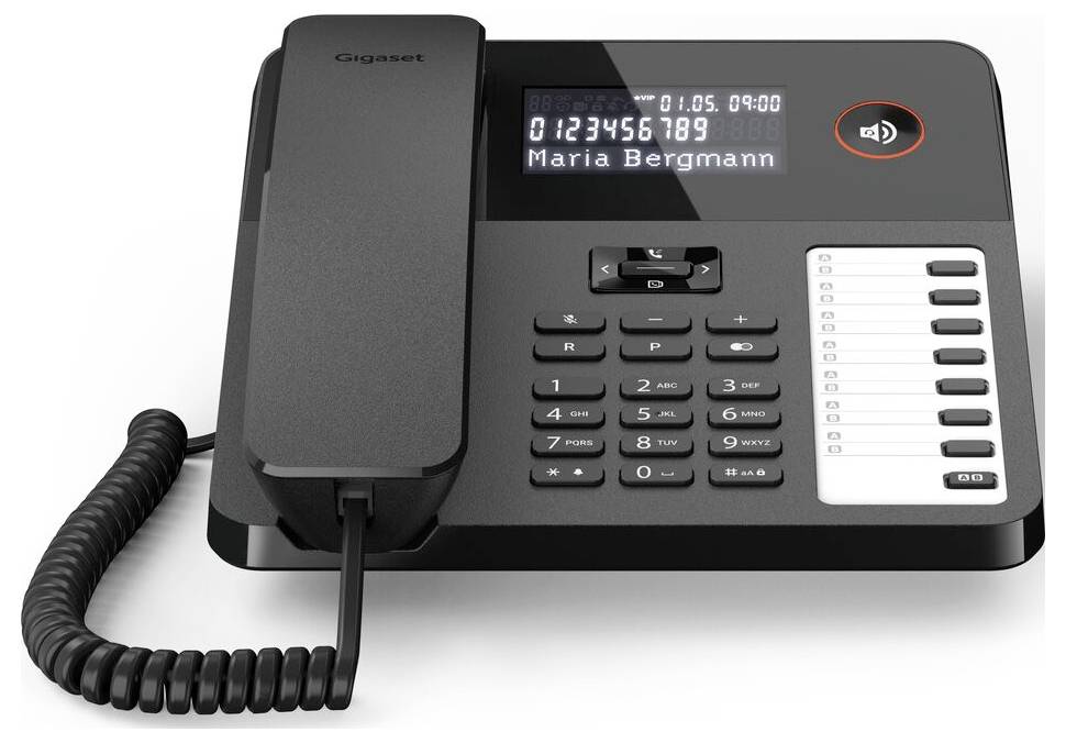 A modern office phone with a digital display showing '0123456789 Maria Bergmann', a keypad, and a visible speakerphone icon.
