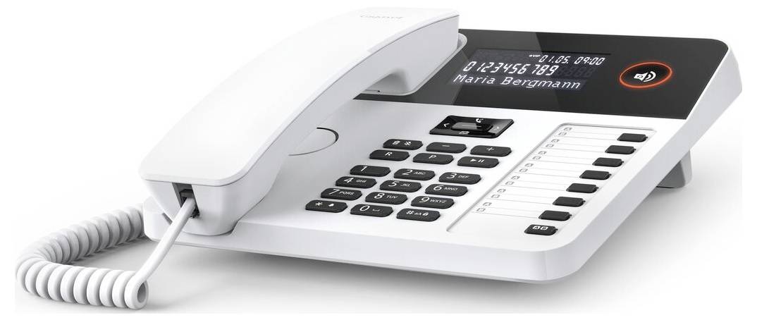 A white office desk phone with a digital display shows the number '0123456789' and name 'Maria Bergmann', featuring a keypad and handset.