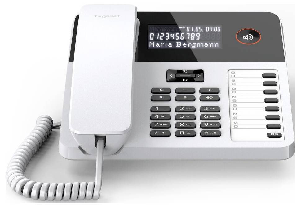 A corded office phone with a digital display showing '0123456789 Maria Bergmann', a keypad, and volume control button.