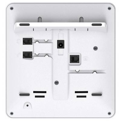 The image shows the back of an electronic device with multiple Ethernet ports, mounting slots, and vent openings, suggesting network connectivity.