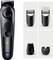 'Braun trimmer with adjustable settings and LED indicator, shown with four attachments for different grooming needs.'