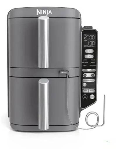 A grey dual-basket air fryer with digital display and control panel on the right side, featuring a temperature probe and 'Ninja' branding on top.