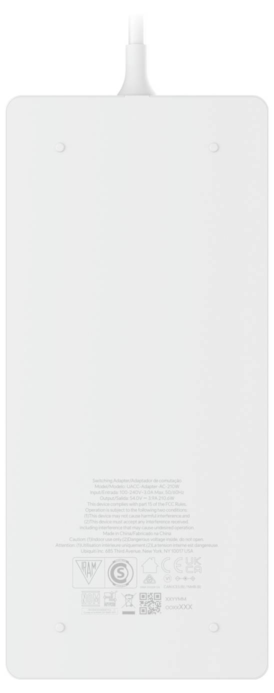 A white power adapter seen from the bottom, with technical specifications and certification logos printed in fine print.